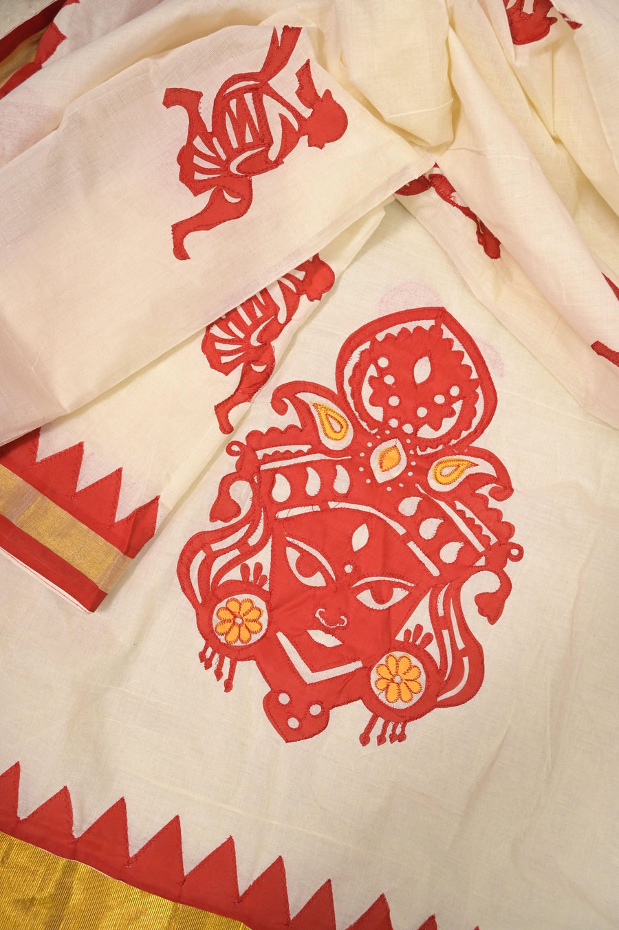 Cotton Saree in Offwhite Color with Durga Applique Work in Red and Yellow