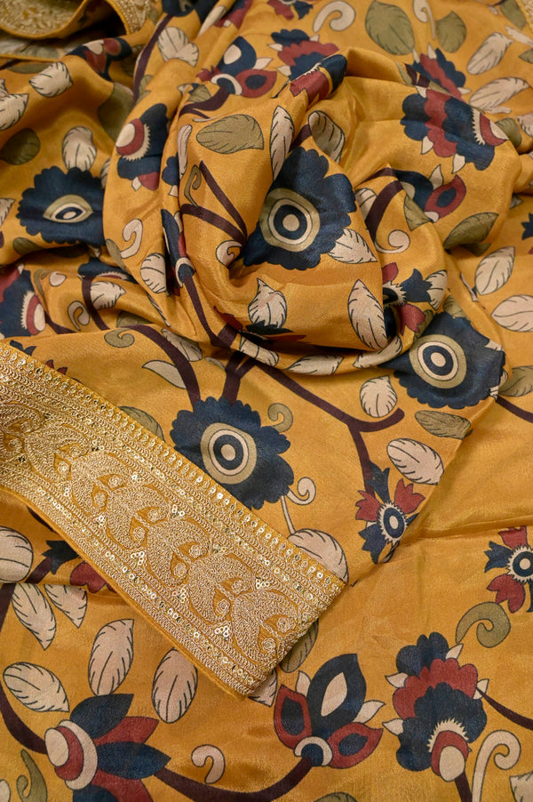 Crepe Saree in Mustard yellow Color with Kalamkari Print and Designer Border with Cod Piping Work
