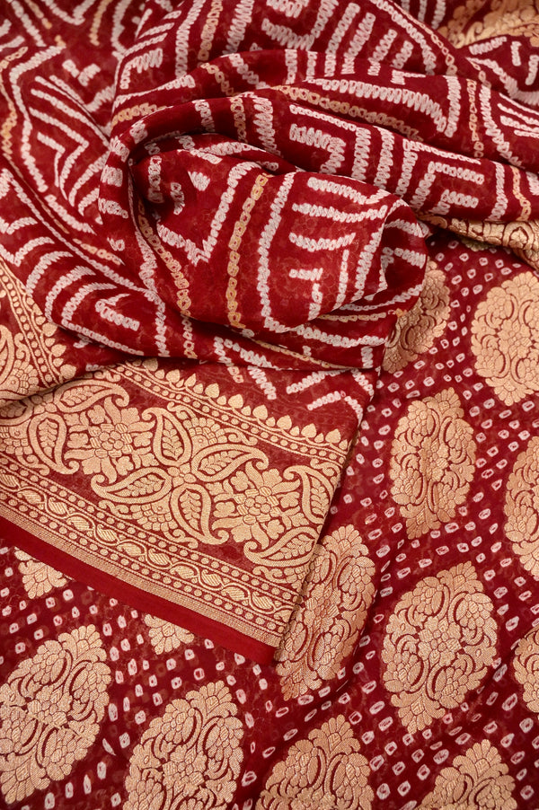 Pure Georgette Banarasi Saree in Reddish Maroon Color with Neem Zari Weaving and Hand Bandhani Work