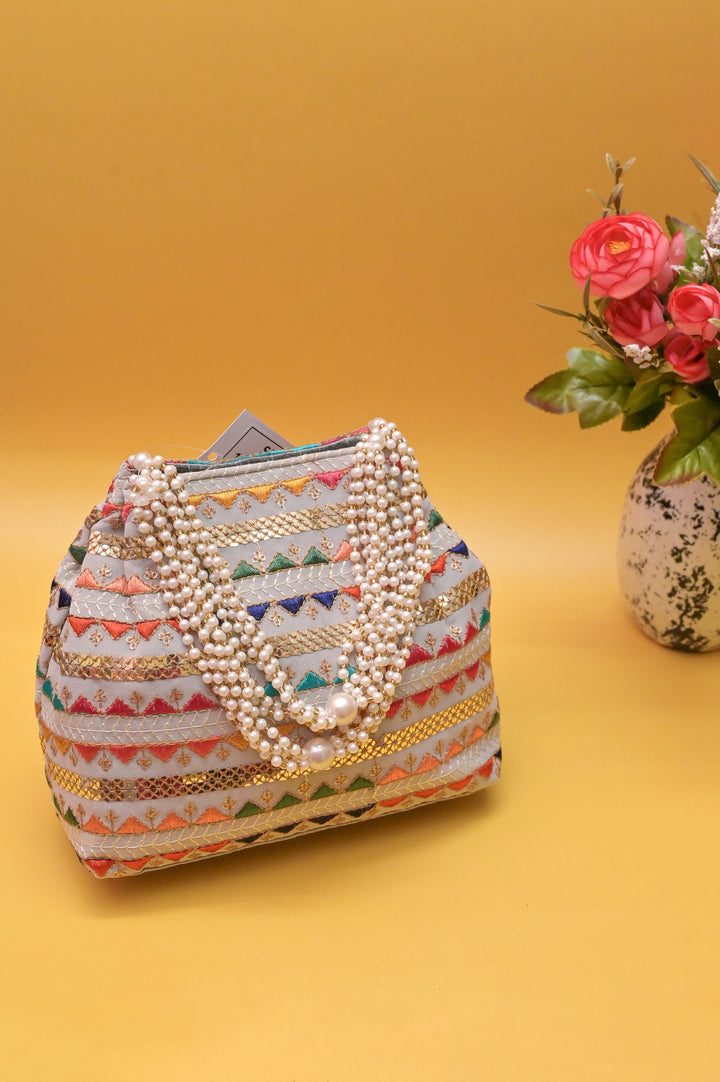 Ash Color Potli Clutch with Embroidery and Pearl Handle