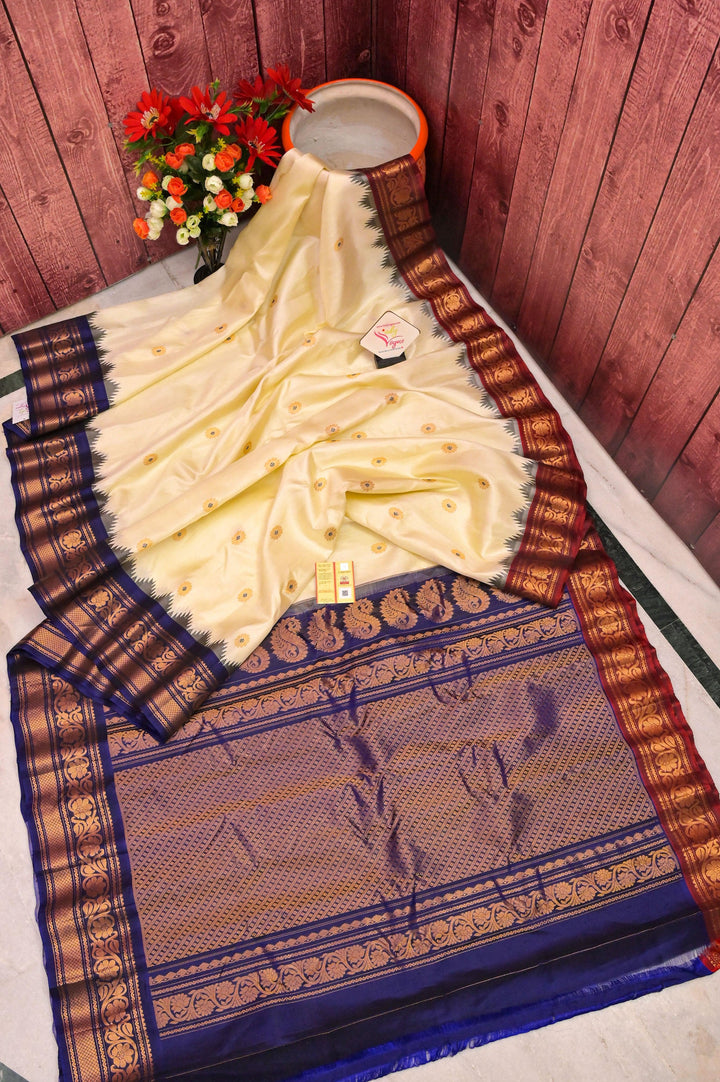 Cream Color Pure Gadwal Silk Saree with Meenakari Buti Work & Ganga Jamuna Border