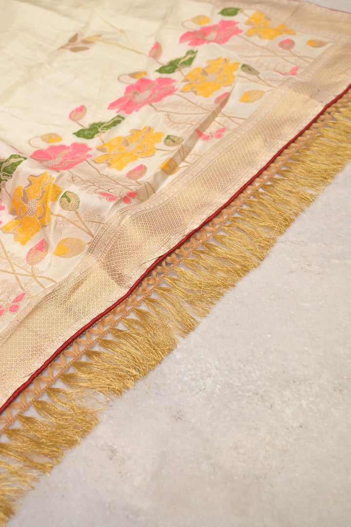 Cream White Color Muga Banarasi Saree with Meenakari Buta and Golden Zari Piping Border