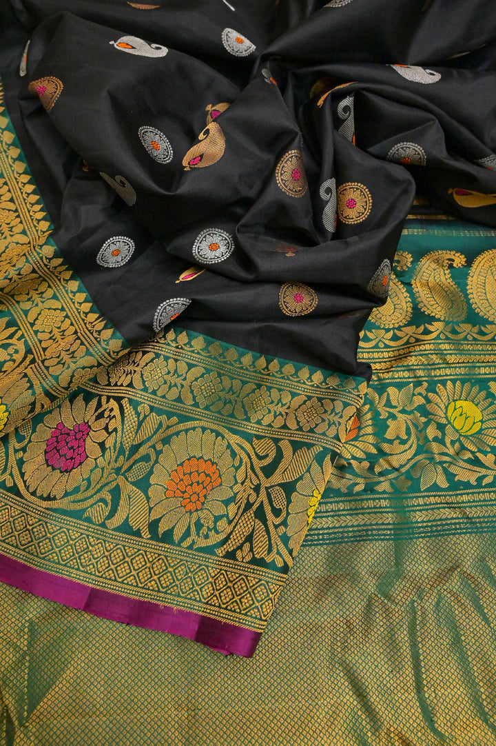 Dark Black Color Pure Gadwal Silk with Meenakari Buti and Golden & Silver Zari Work