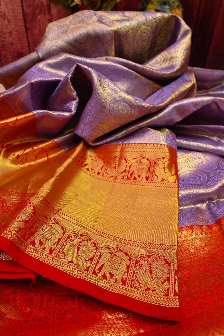 Deep Lavender Color Pure Brocade Kanjeevaram with Broad Golden Zari Border
