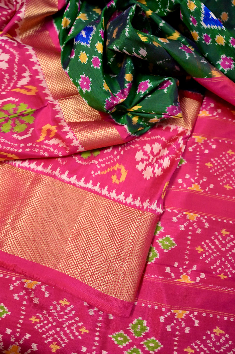 Pure Ikat Silk Saree in Dark Green Color with Allover Ikat Weaving and Golden Zari Border