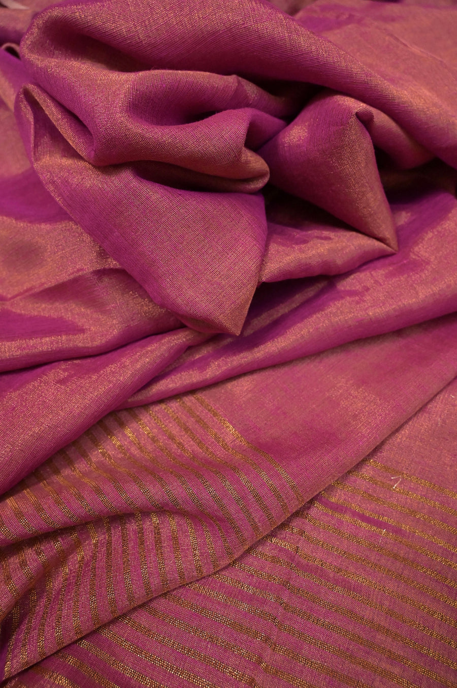 Tissue Linen Saree in Metallic Dark Magenta Color with Zari Stripe Work on Pallu