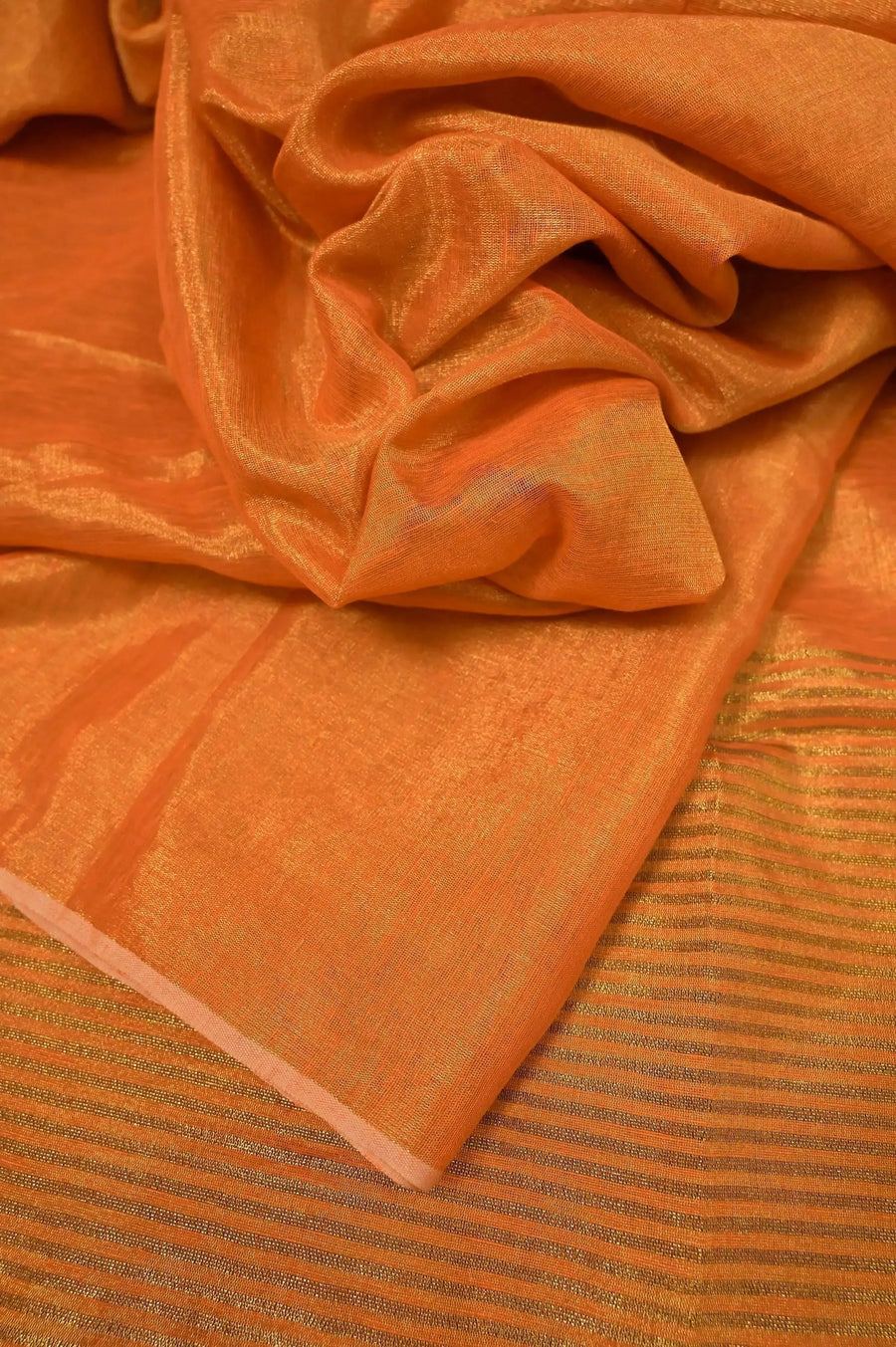 Tissue Linen Saree in Metallic Orange Color with Zari Stripe Work on Pallu