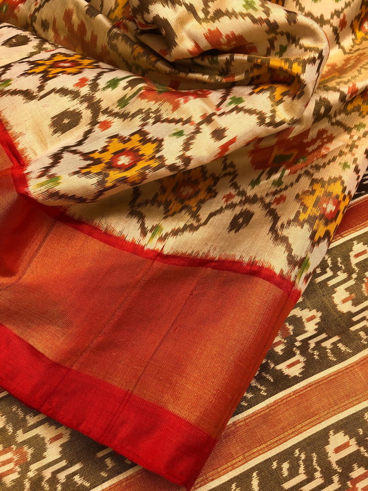 Cream and Red Color Pure Tissue Ikat Silk Saree with Allover Ikat Work